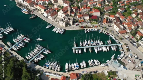 Yachts And Sailboats Moored On The Marina And Jetty Near Milna Village In Brac, Croatian Island. - aerial photo