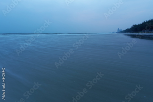 Emply ocean view from remote place at dusk, Lonely wandering in Dark beach photo