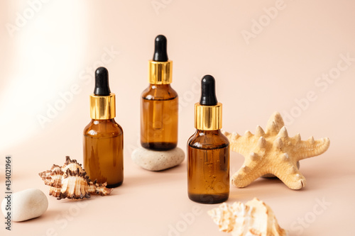 Set of facial serum in glass bottles with pipette, natural organic spa cosmetic. Skin care concept