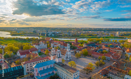 Aerial view of a sunny day in Kaunas city town hall square with towers of churches, castle, cathedral and Neris river around