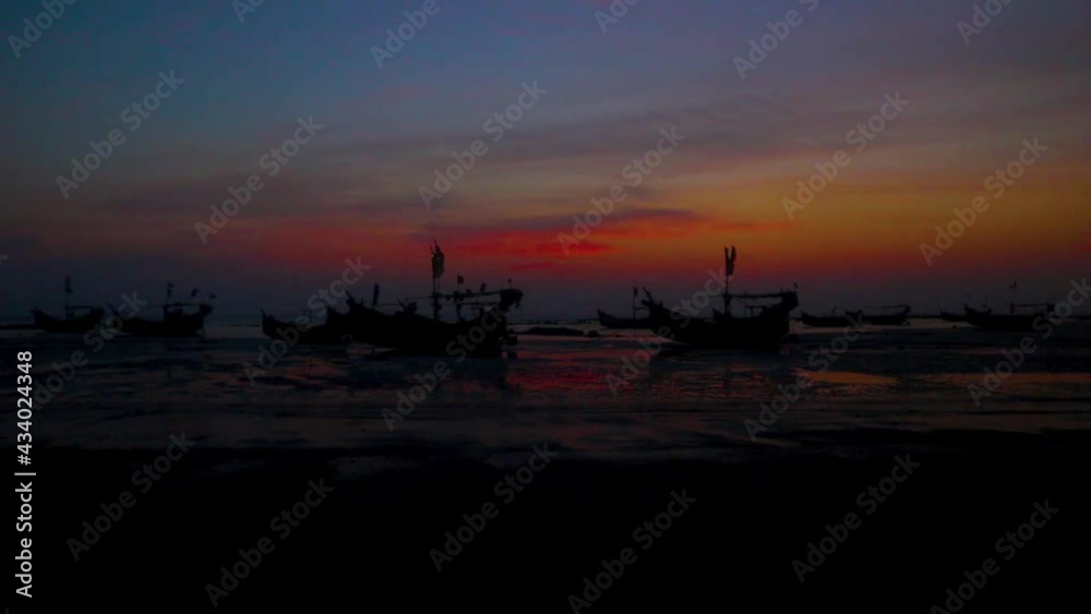 Dawn at low tide beach with Sampan trawler in Saint Martin Island Dawn at low tide beach with Sampan trawler in Saint Martin Island