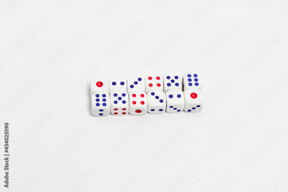 some of dice on white background. high key photography.