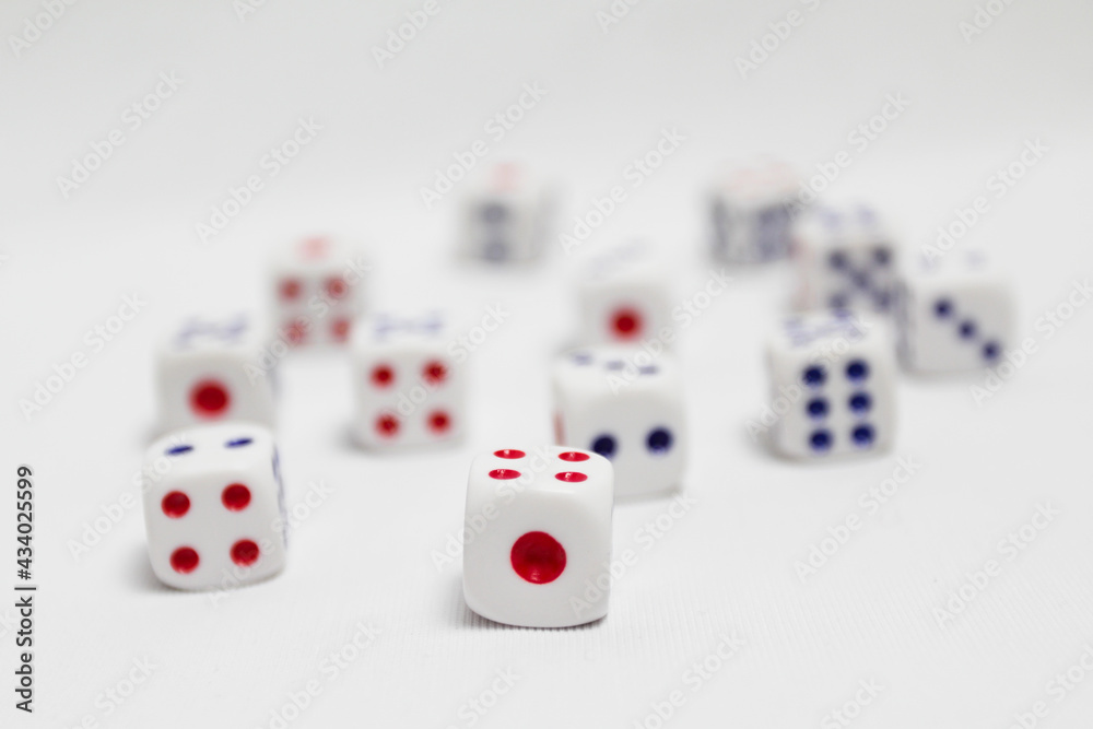 selective focus of spread of dice on white background. high key photography. selective focus of spread of dice on white background. high key photography.