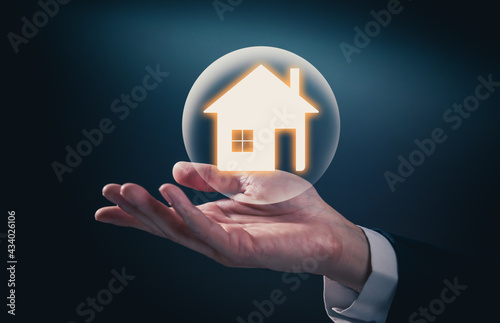House icon on the hand, mortgage loan home and insurance concept.