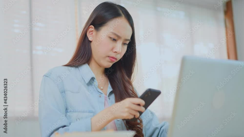 Asian girl feeling hungry while busy with working or learning at home. Asian girl feeling hungry while busy with working or learning at home.