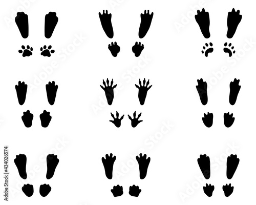 Black silhouettes of traces of rabbits on a white background