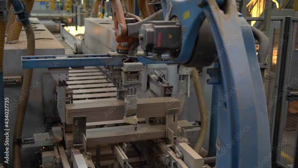 Robotic arm in action, parquet factory Robotic arm in action, parquet factory