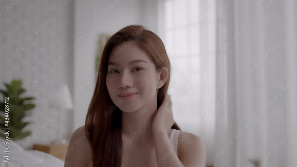 Beauty Asian woman check face after make up. Beauty Asian woman check face after make up.