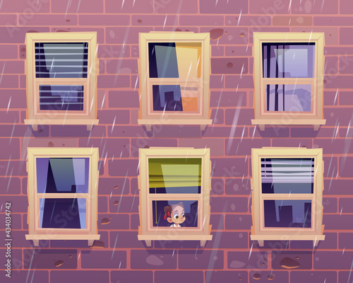 Sad girl looks through window at rain outside. Building facade with brick wall and closed glass windows with curtains and blind. Vector cartoon illustration of house front and child inside apartment
