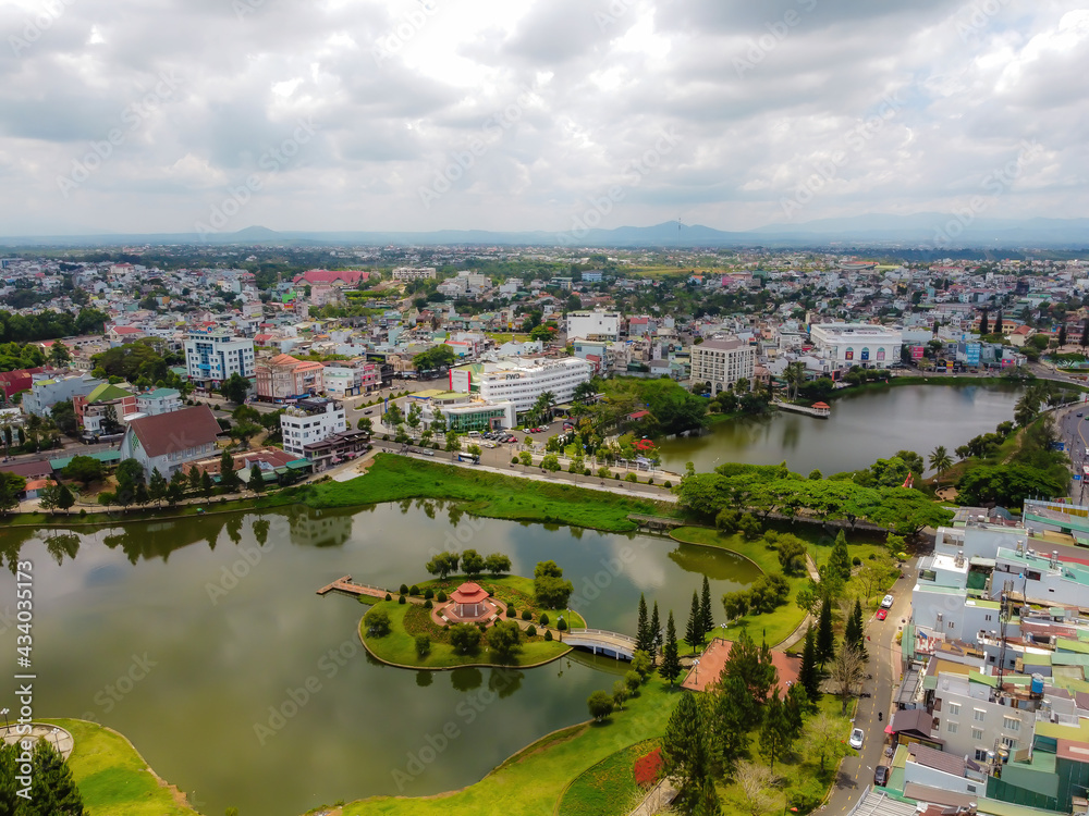 Aerial view of small Dong Nai lake - a central lake in Bao Loc city, Lam Dong province, Vietnam. It is a nice beside big TV tower.