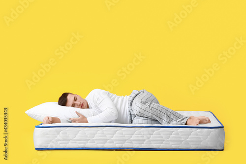 Young man sleeping on soft ...