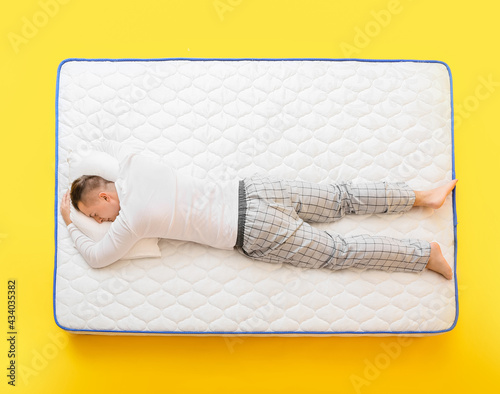 Young man sleeping on soft ...