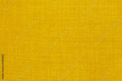 Yellow golden cotton fabric texture background, seamless pattern of natural textile.