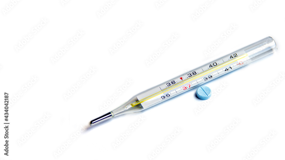 Mercury thermometer for measuring body temperature and tablet. Diagnostics and treatment of diseases. Empty space. Mercury thermometer for measuring body temperature and tablet. Diagnostics and treatment of diseases. Empty space.