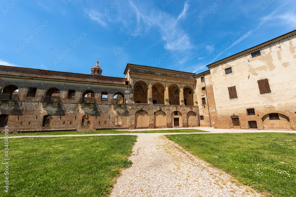 New Court (1536) of the Ducal Palace (Palazzo Ducale) or Gonzaga Royal Palace and the bell tower of the Palatine Basilica of Santa Barbara (1562-1572) in Mantua downtown. Lombardy, Italy, Europe.