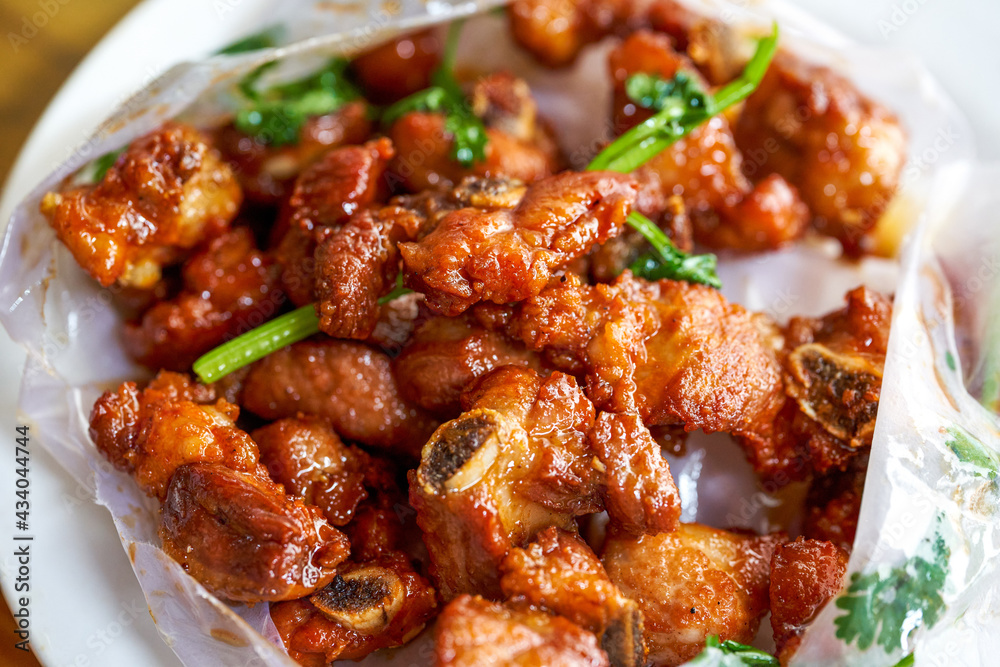 A delicious Chinese dish, paper-wrapped pork ribs A delicious Chinese dish, paper-wrapped pork ribs