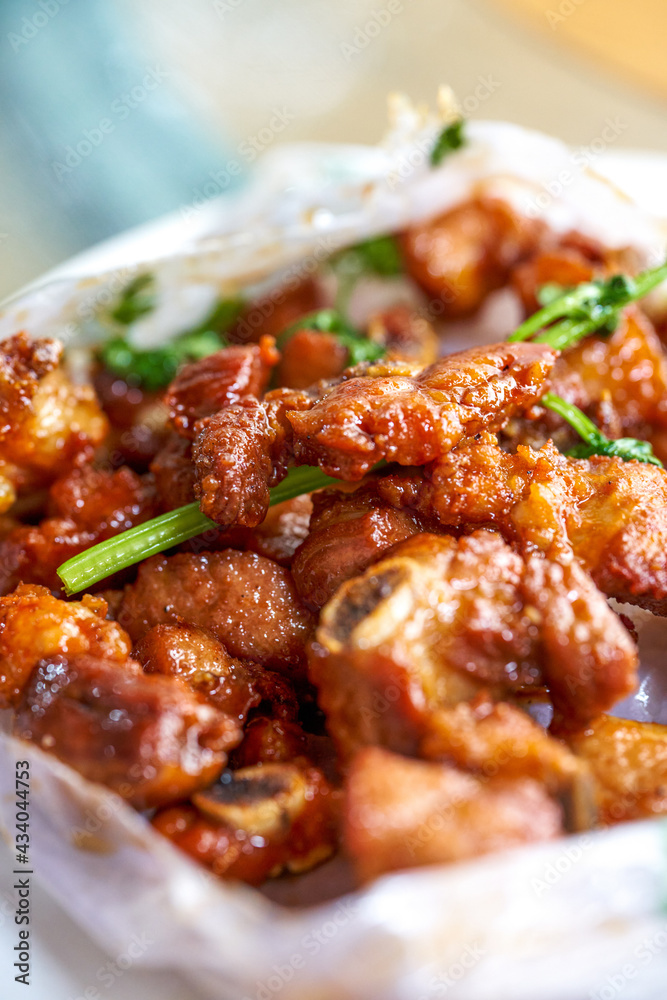 A delicious Chinese dish, paper-wrapped pork ribs A delicious Chinese dish, paper-wrapped pork ribs