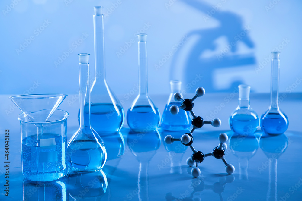 Laboratory beakers,Science experiment, blue background Laboratory beakers,Science experiment, blue background