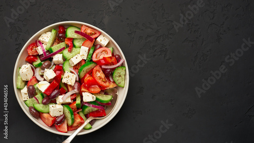 A big bowl of classic Greek salad top view with copy space