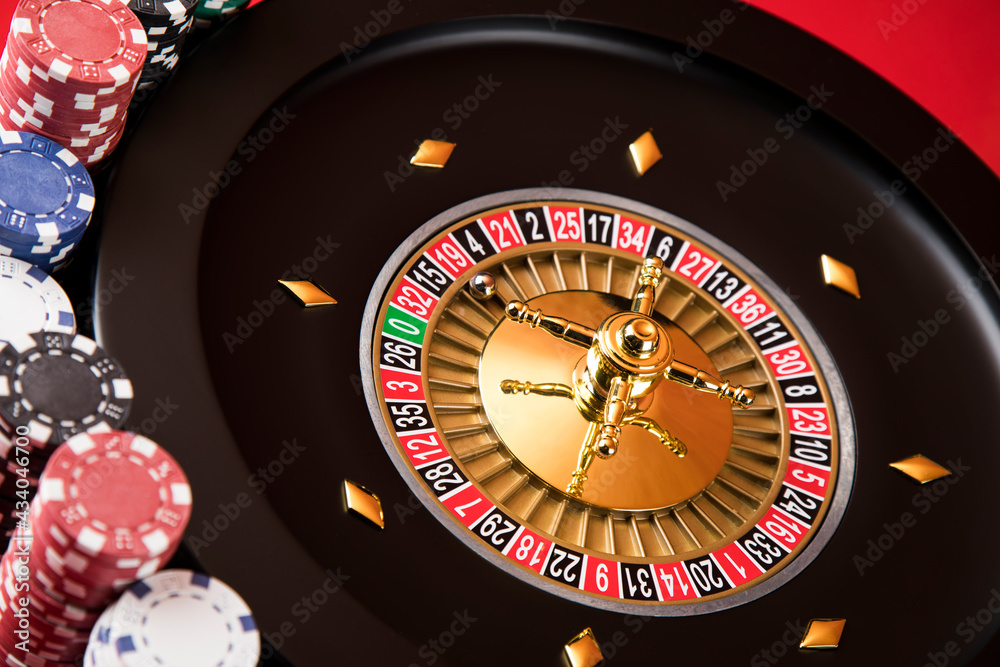 Roulette wheel running in a casino, Poker Chips Roulette wheel running in a casino, Poker Chips
