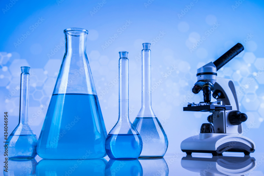 Laboratory beakers,Science experiment, blue background Laboratory beakers,Science experiment, blue background