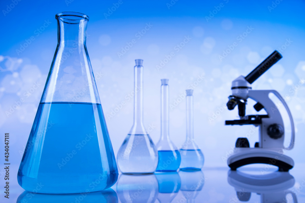 Laboratory beakers,Science experiment, blue background Laboratory beakers,Science experiment, blue background