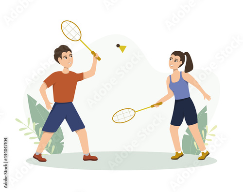 Young people play badminton on the street