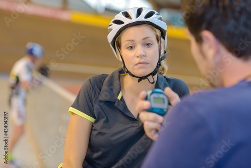 female cycling athlet while competing in olympic velodrome