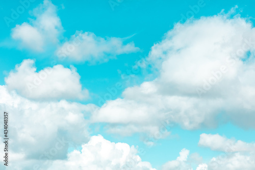 Fototapeta Naklejka Na Ścianę i Meble -  Vibrant blue sky and white clouds background, vivid colors