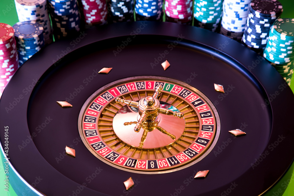 Roulette wheel in motion in a casino background Roulette wheel in motion in a casino background