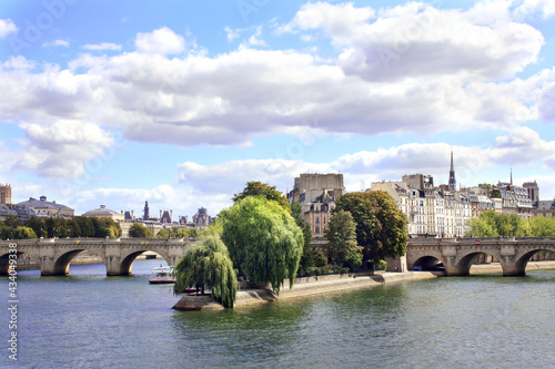 Medieval bridge and buildings on waterfront of Seine river,  Paris, France