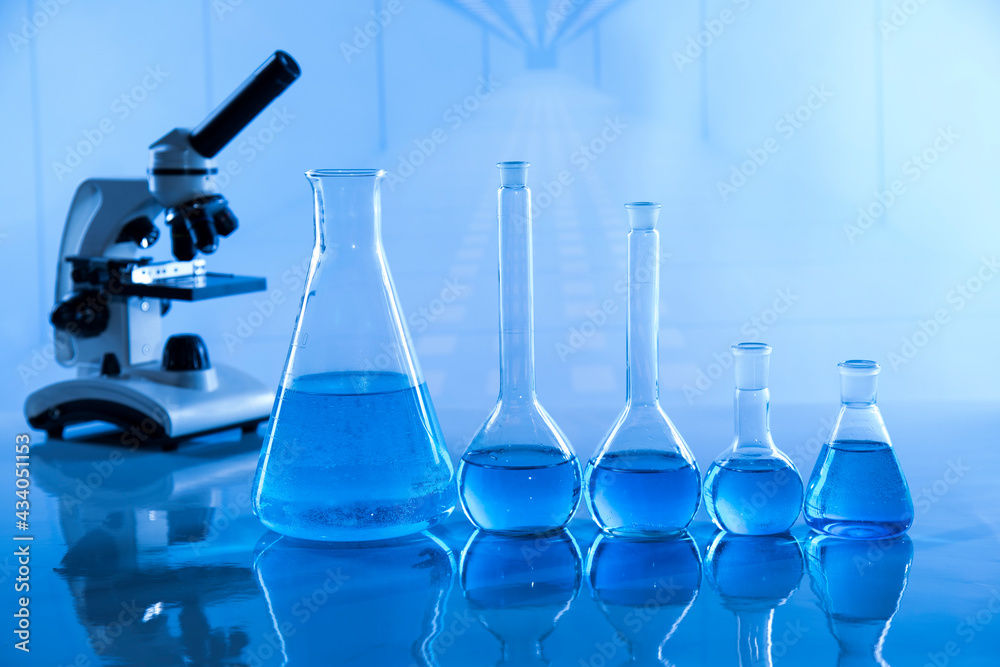 Laboratory beakers,Science experiment, blue background Laboratory beakers,Science experiment, blue background