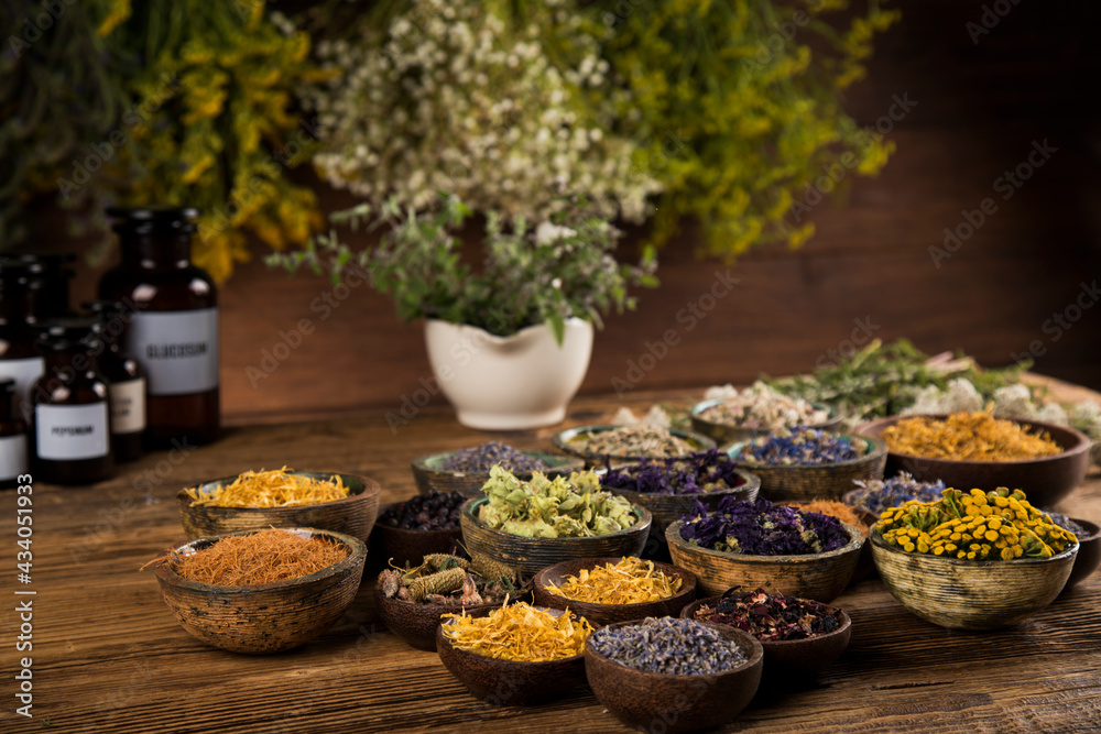Homeopathy, herbal medicine on wooden table Homeopathy, herbal medicine on wooden table