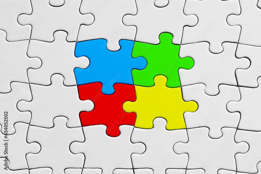 Colorful jigsaw puzzle pieces stand out from the crowd. Diversity, unity, cooperation or interaction Colorful jigsaw puzzle pieces stand out from the crowd. Diversity, unity, cooperation or interaction