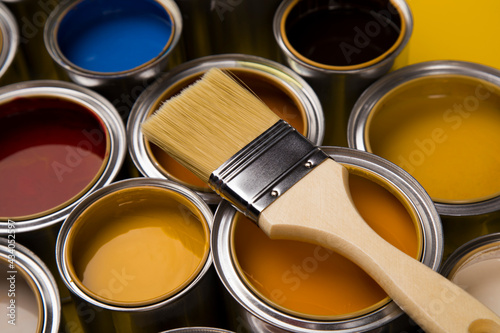 Open paint cans with a brush, Rainbow colors