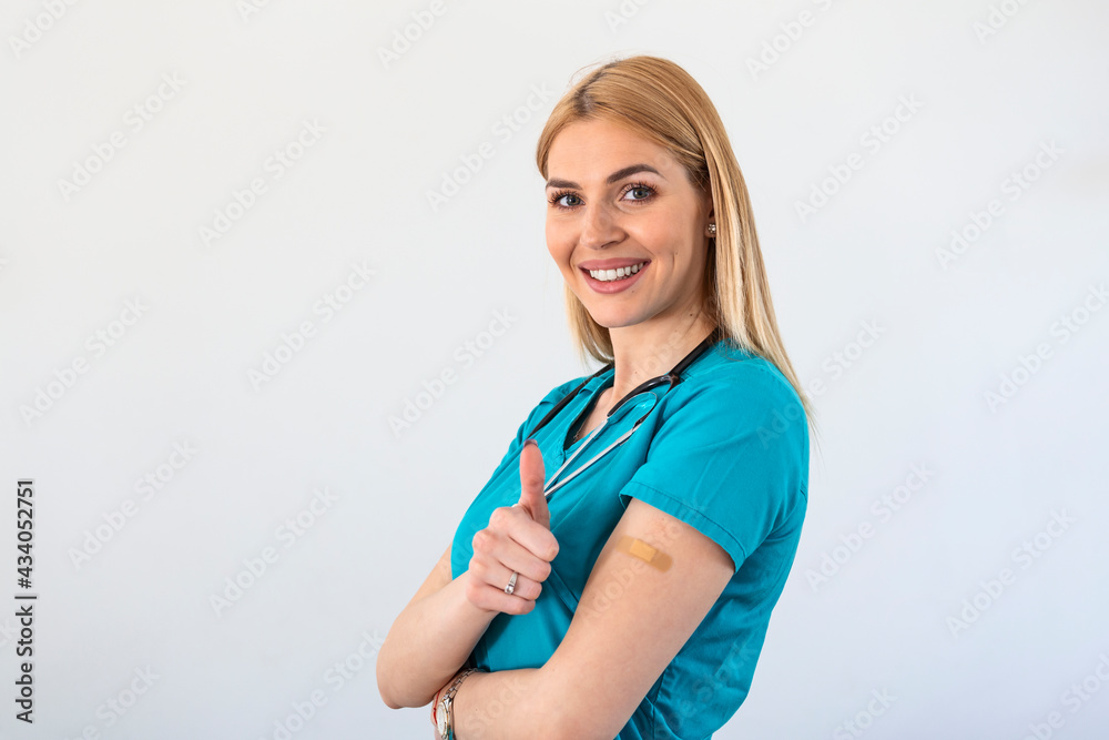 Vaccinated young Doctor, medical worker, nurse Woman Gesturing Thumbs-Up Approving Vaccination, white Background Vaccinated young Doctor, medical worker, nurse Woman Gesturing Thumbs-Up Approving Vaccination, white Background