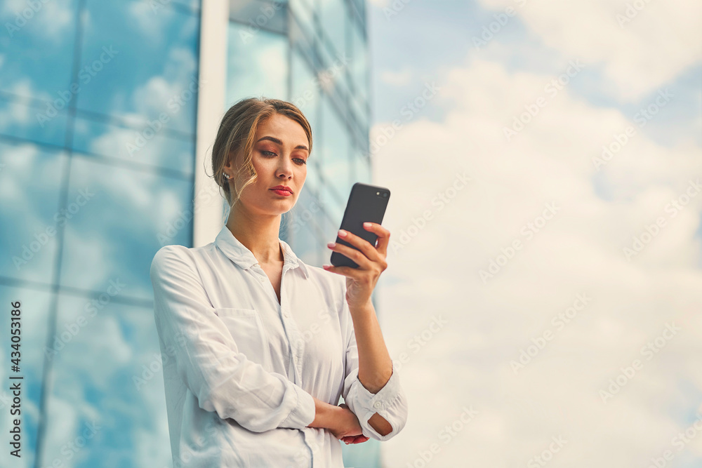 Businesswoman successful woman business person standing outdoor corporate building exterior. Pensive caucasian confidence professional business woman middle age