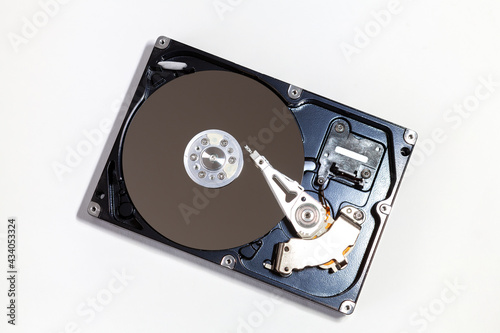 Opened hard drive disc, isolated on white background