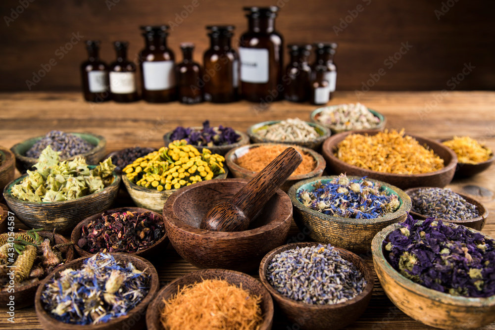 Assorted natural medical, herbs and mortar Assorted natural medical, herbs and mortar