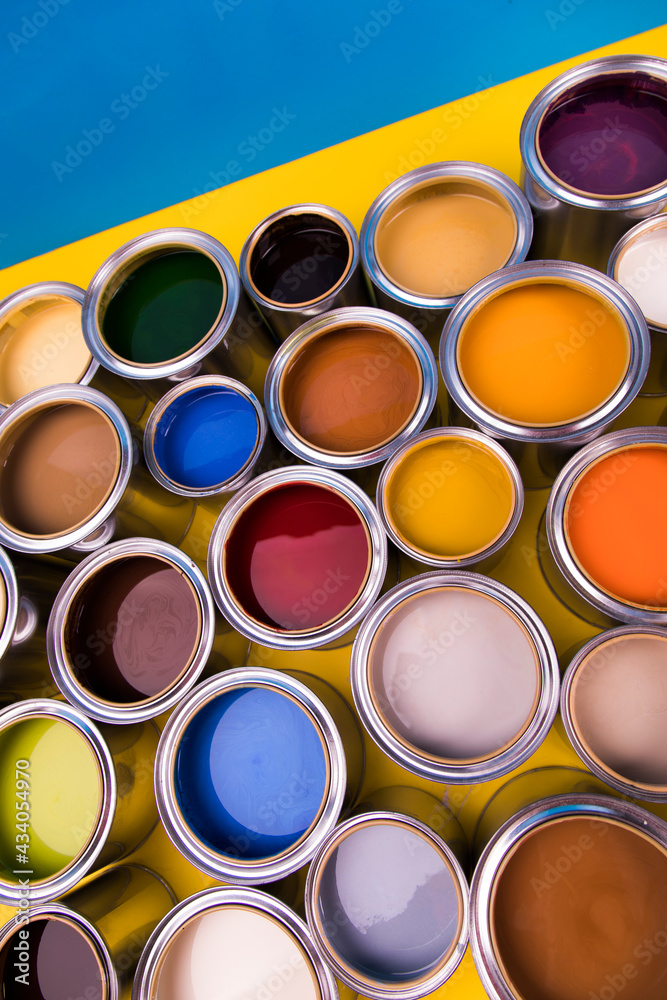 Fototapeta premium Full Buckets of rainbow colored oil paint