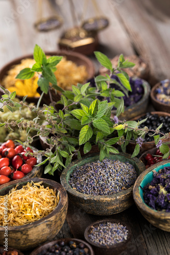 Herbs medicine and vintage wooden background