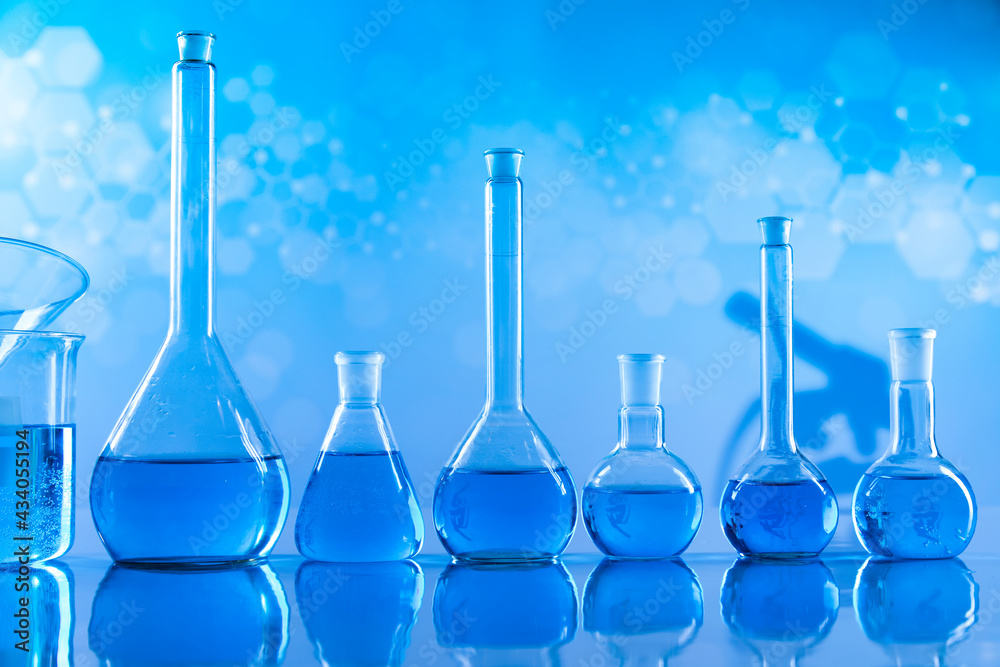 Laboratory beakers,Science experiment, blue background Laboratory beakers,Science experiment, blue background