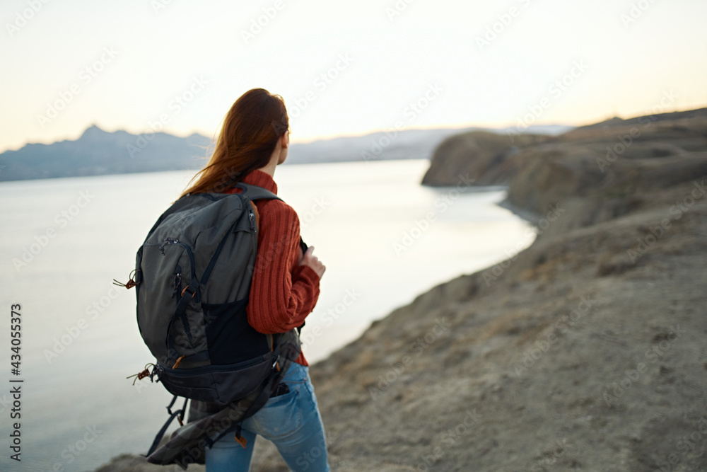 woman travels in the mountains outdoors near the sea cropped view portrait woman travels in the mountains outdoors near the sea cropped view portrait