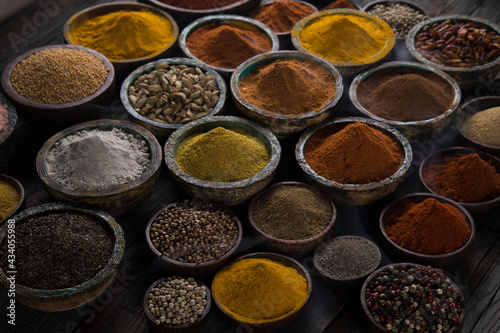 Spices and herbs selection on wooden background