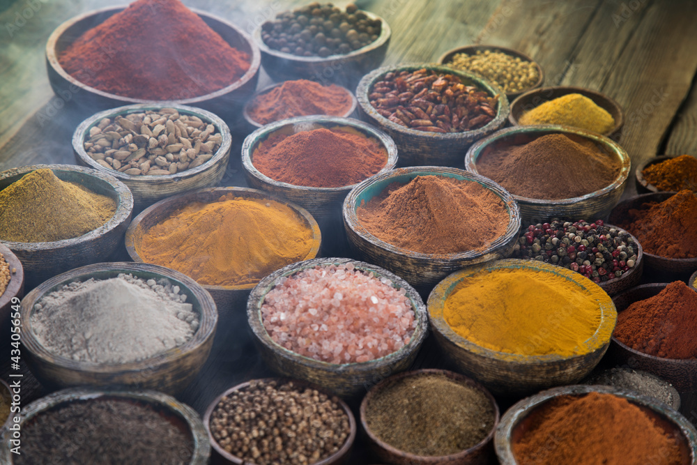 Spices on wooden bowl background Spices on wooden bowl background