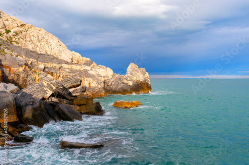 View on Byron Grotto in the Bay of Poets, turquoise color of the sea, Portovenere, Italian Riviera, Italy photo