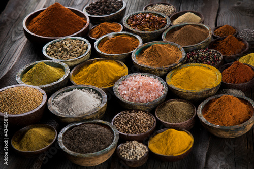 Colorful spices in bowl background