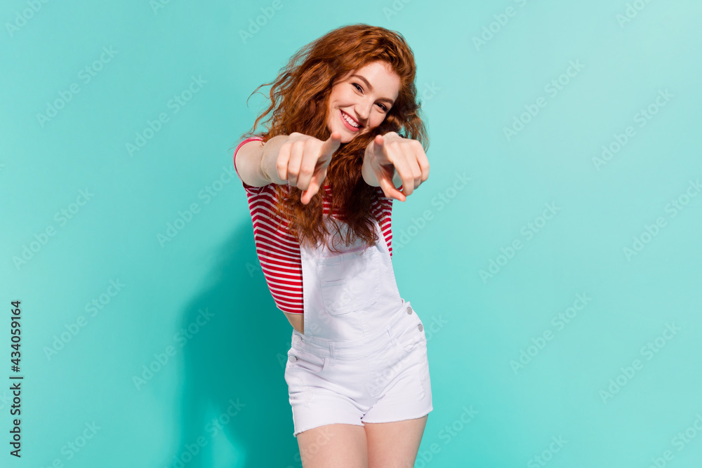 Portrait of attractive glad cheerful girl pointing at you best choice isolated bright blue color background Portrait of attractive glad cheerful girl pointing at you best choice isolated bright blue color background