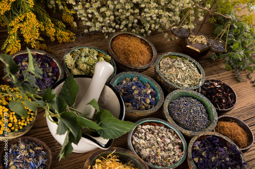 Natural medicine and mortar  healing herbs background
