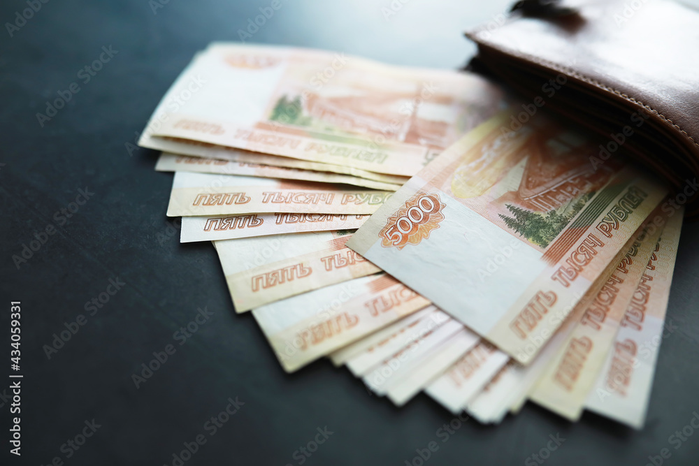 Russian money face value of five thousand rubles. Close-up of Russian rubles . The concept of Finance.Background and texture of money Russian money face value of five thousand rubles. Close-up of Russian rubles . The concept of Finance.Background and texture of money